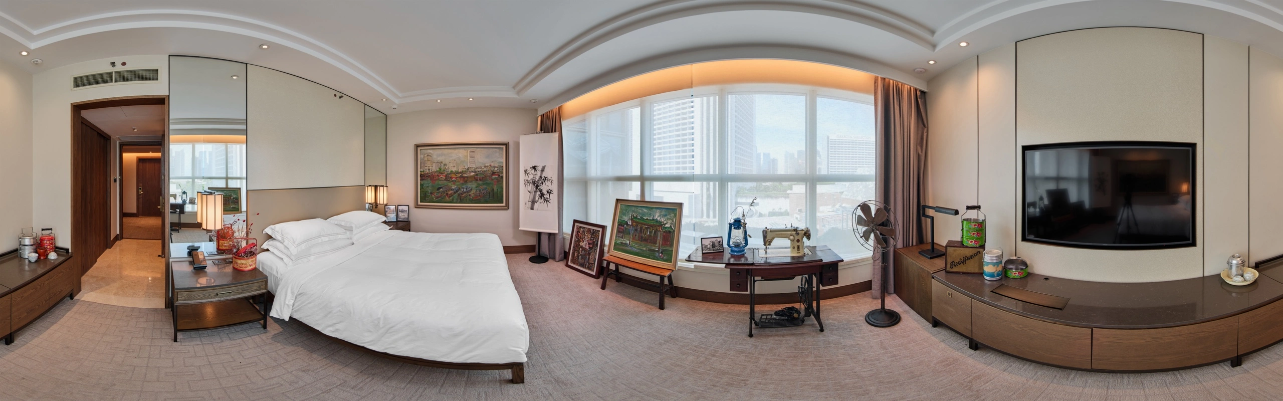 Panoramic view of a #GBK85 exhibition suite with Goh Beng Kwan artworks, archival objects and a sewing machine
