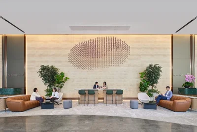 One Raffles Quay south tower office lobby with reception desk and lounge seating