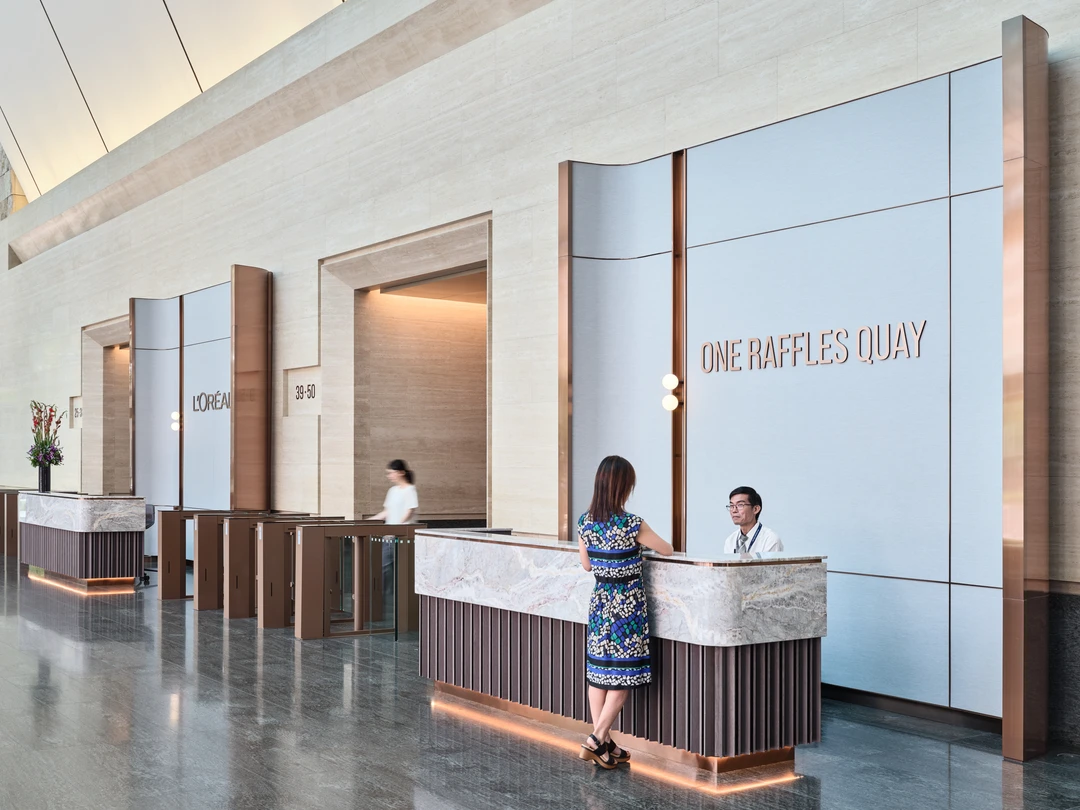 One Raffles Quay North Tower reception counter with building signage