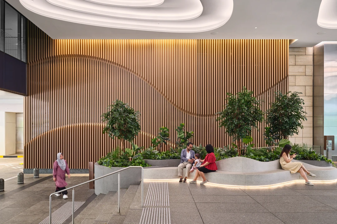 One Raffles Quay Garden Plaza interior seating area with timber wall and planting