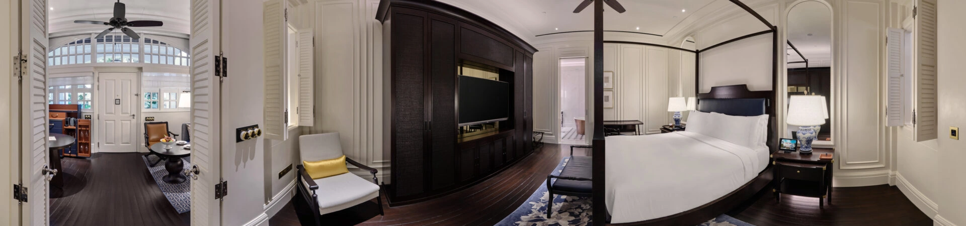 360 panorama of Raffles Hotel courtyard suite bedroom with four-poster bed, dark wood paneling and louvered doors