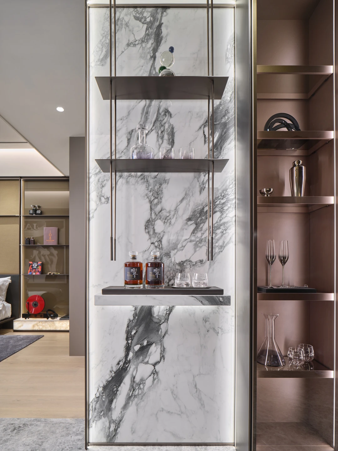 W Residences 1-bedroom showflat bar display with marble wall, glass shelving and bronze cabinetry, wide view