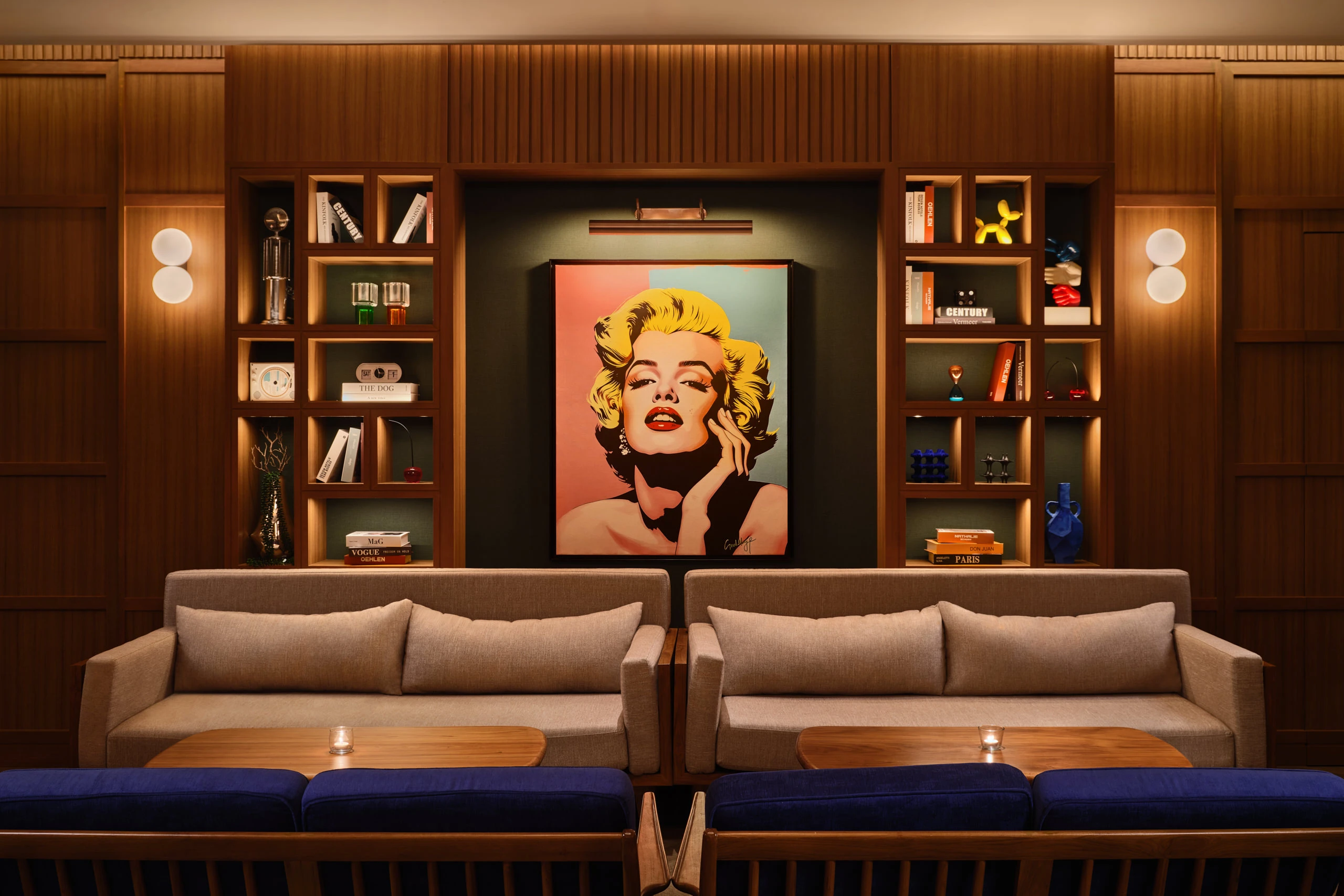 APT 101 Bangkok entertainment room lounge with sofas and statement art