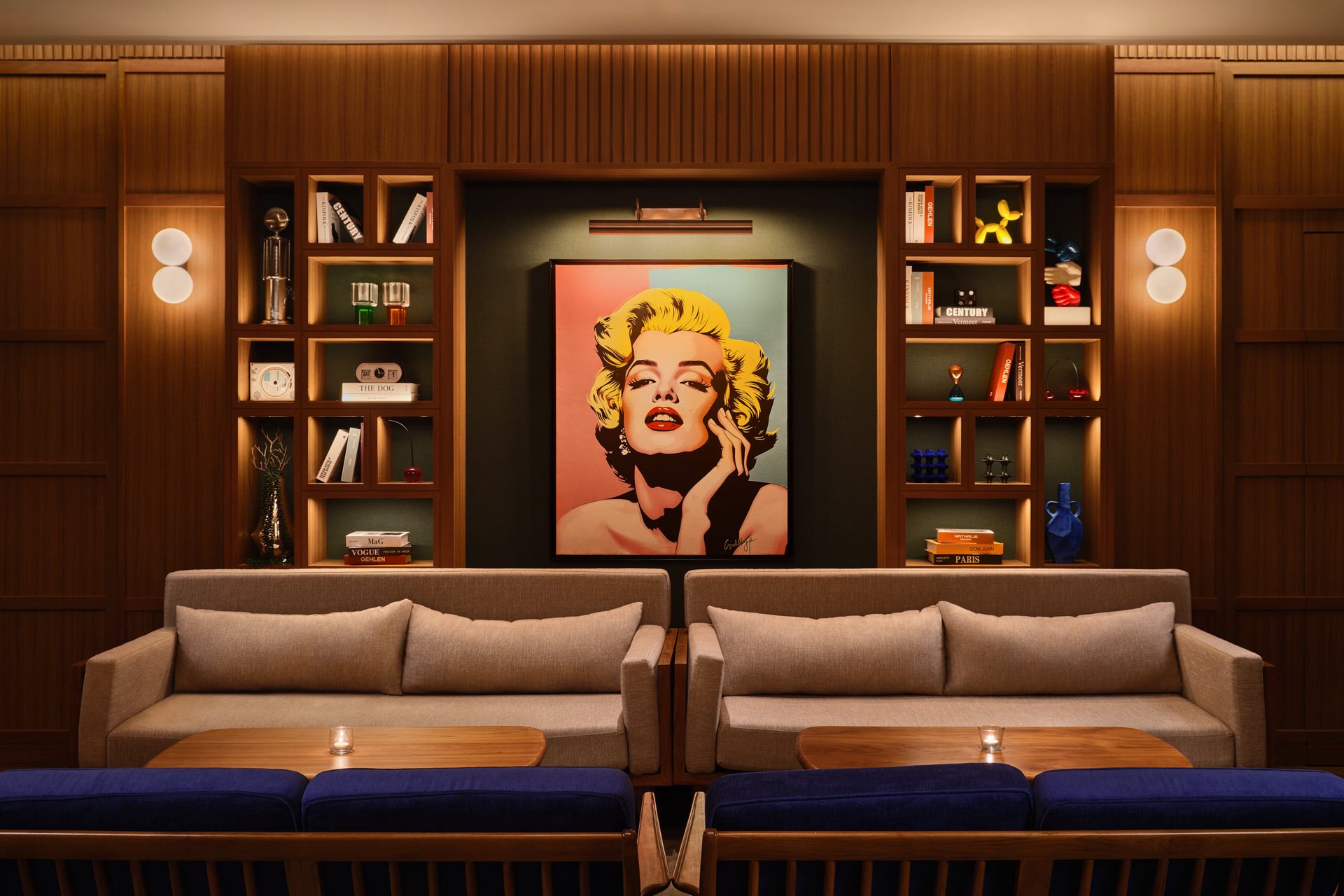 APT 101 Bangkok entertainment room lounge with sofas and statement art