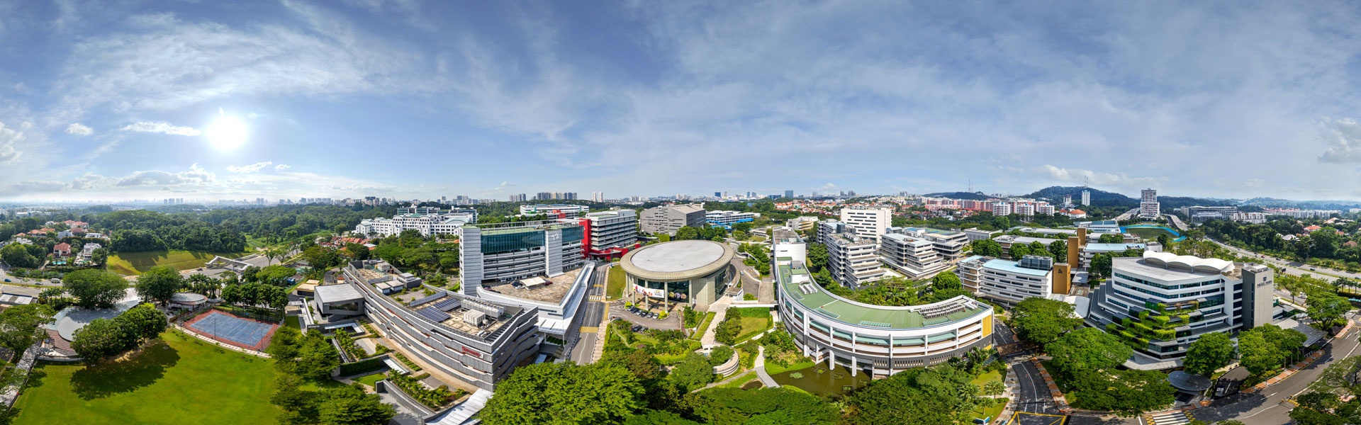 Aerial 360 panorama of Ngee Ann Polytechnic campus with academic buildings, courtyards and surrounding greenery