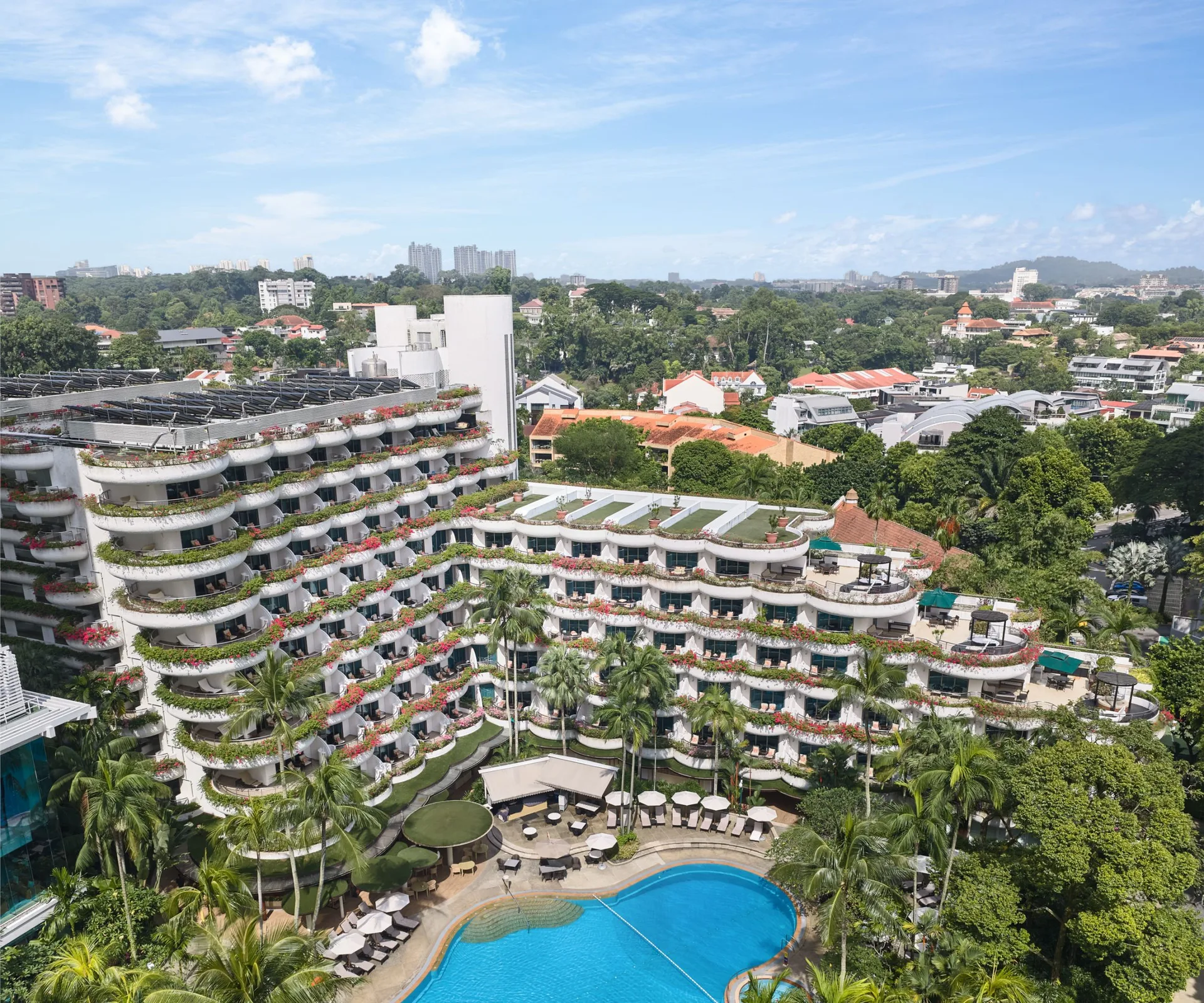 Aerial architectural photograph of Shangri-La Hotel Singapore facade and entrance canopy from Orchard Road