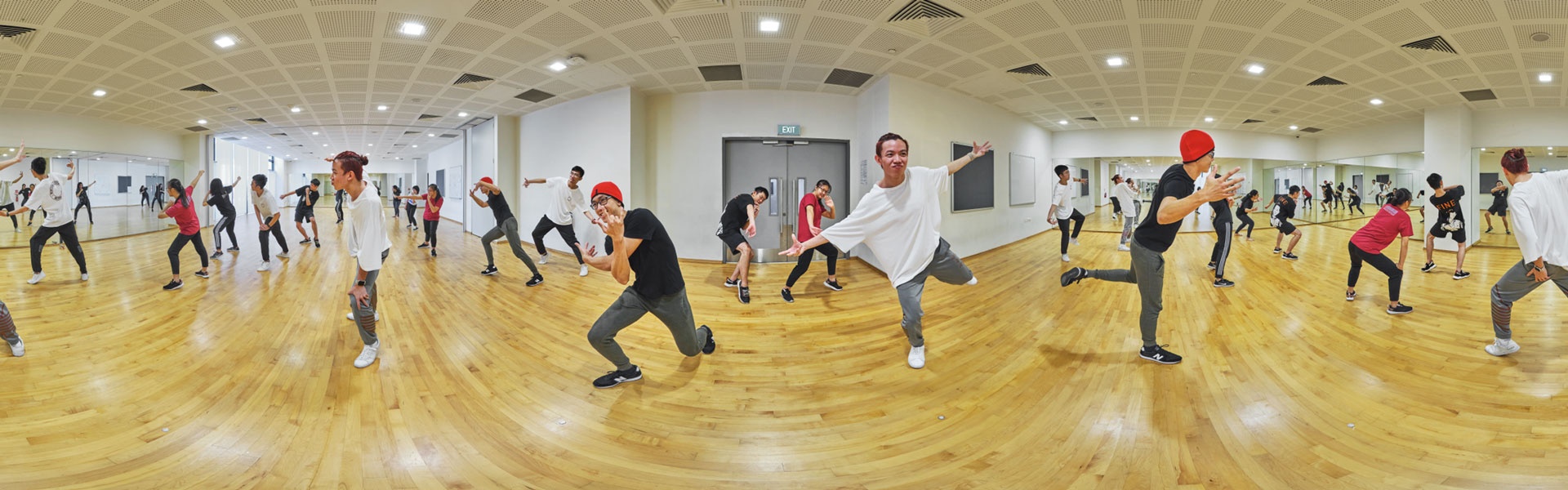 360 panorama of SUTD dance studio with students performing hip-hop choreography on timber floor