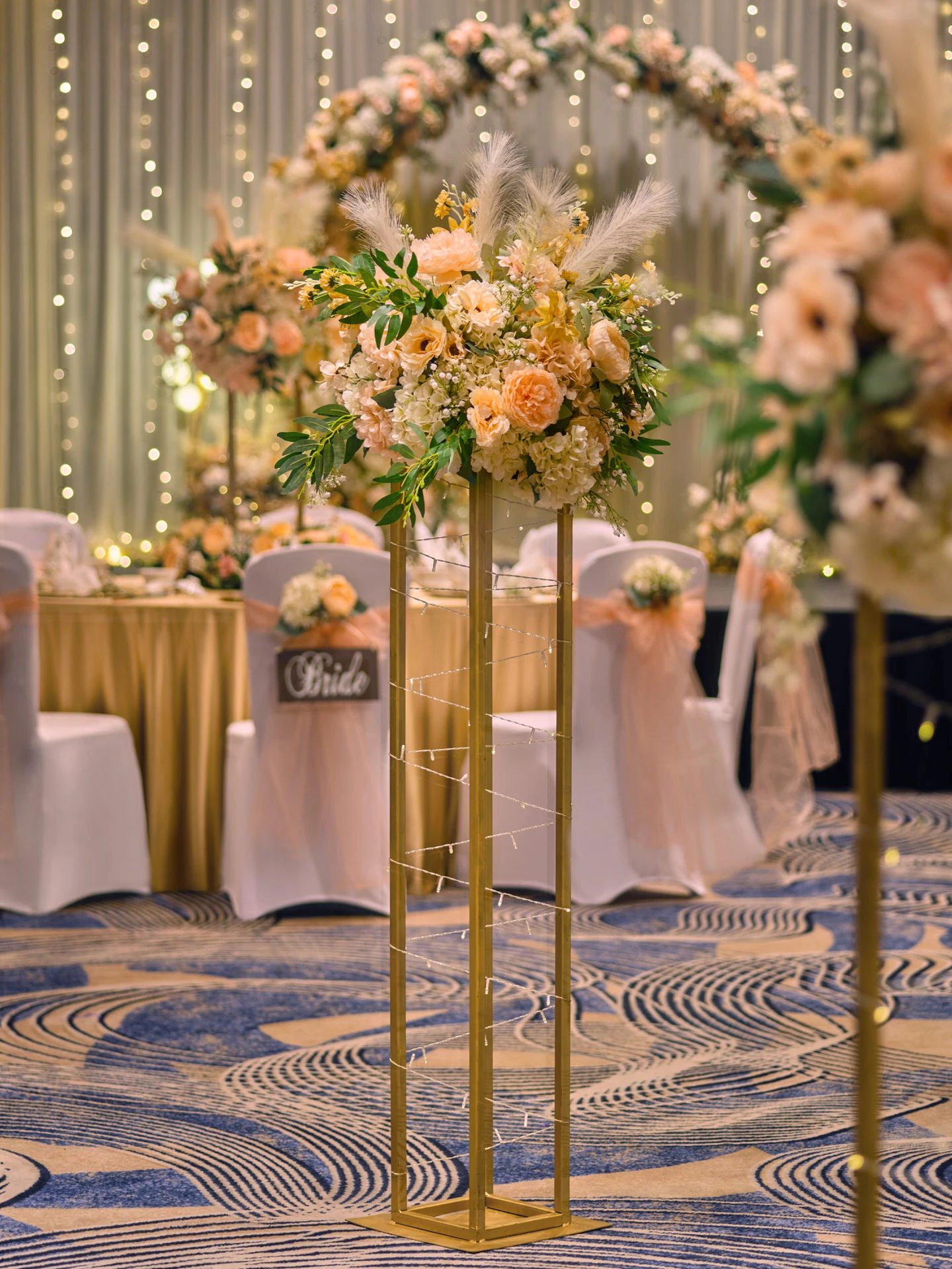 Gold geometric aisle pedestal with roses, hydrangeas and pampas grass - voco Orchard Singapore wedding photography