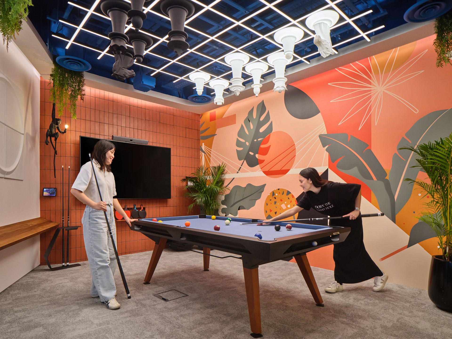 Games room with pool table, ceiling chess set and monkey statue