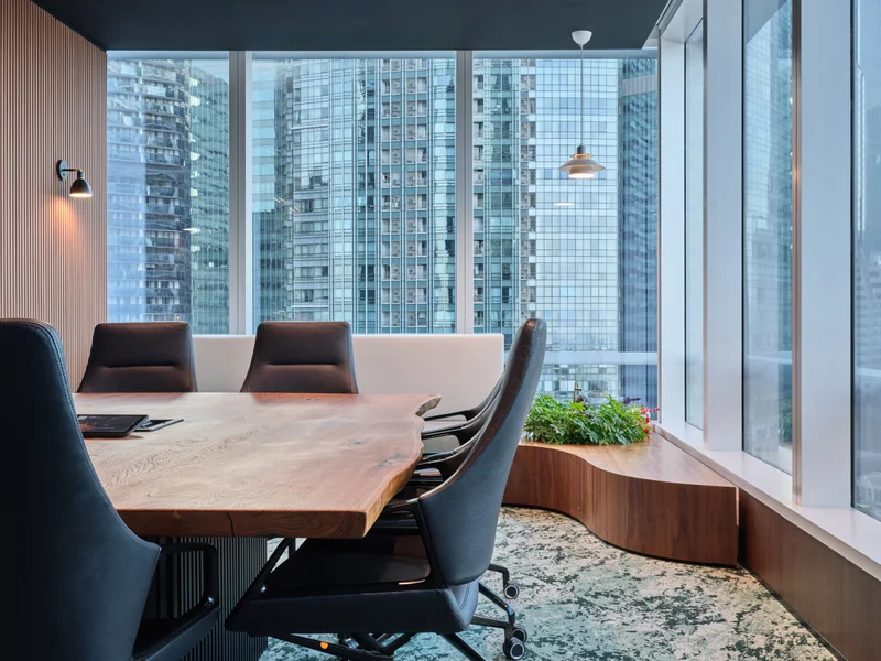 Boardroom with glass partitions and timber-panelled walls