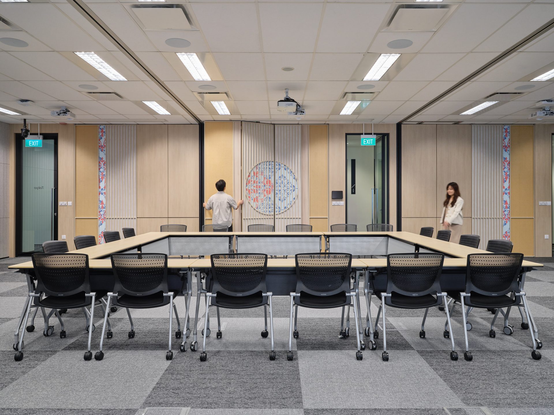 U-shape conference room with wood panels and ceiling projectors