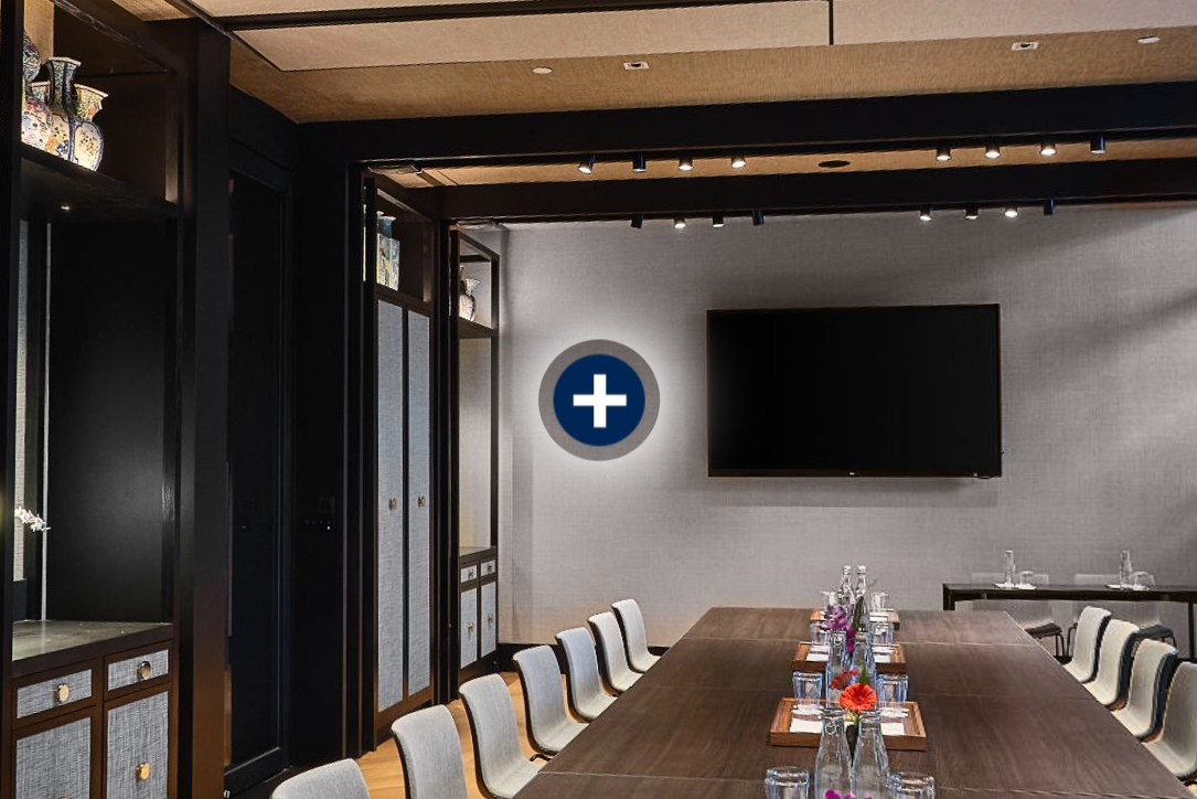 virtual tour feature called multispot which shows a hotspot which opens to show multiple hotspots in a meeting room in it's closed state