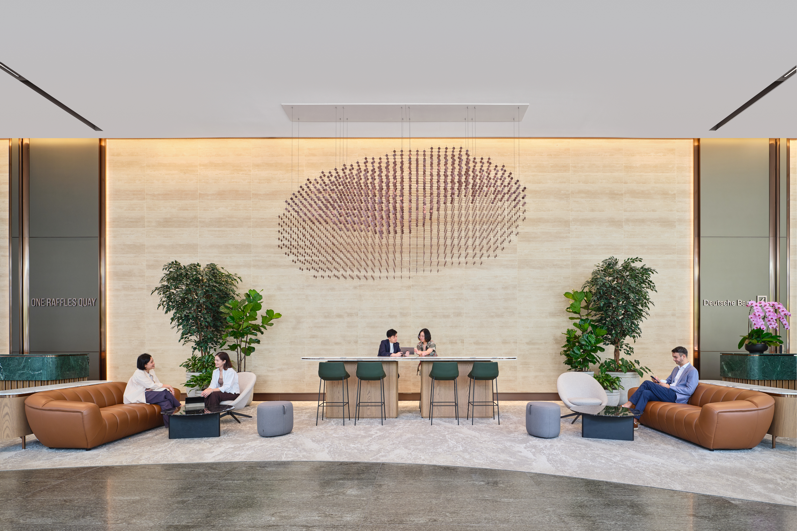 One Raffles Quay South Tower reception seating area with circular wall feature. Architectural photography for Gensler by Christopher O&rsquo;Grady, Singapore.