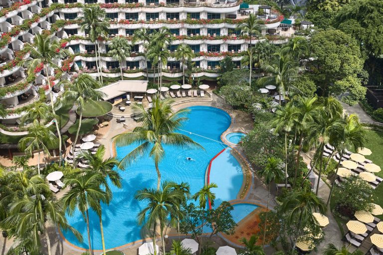 Aerial view of Shangri-La Hotel Singapore pool landscape and tropical gardens along Orange Grove Road