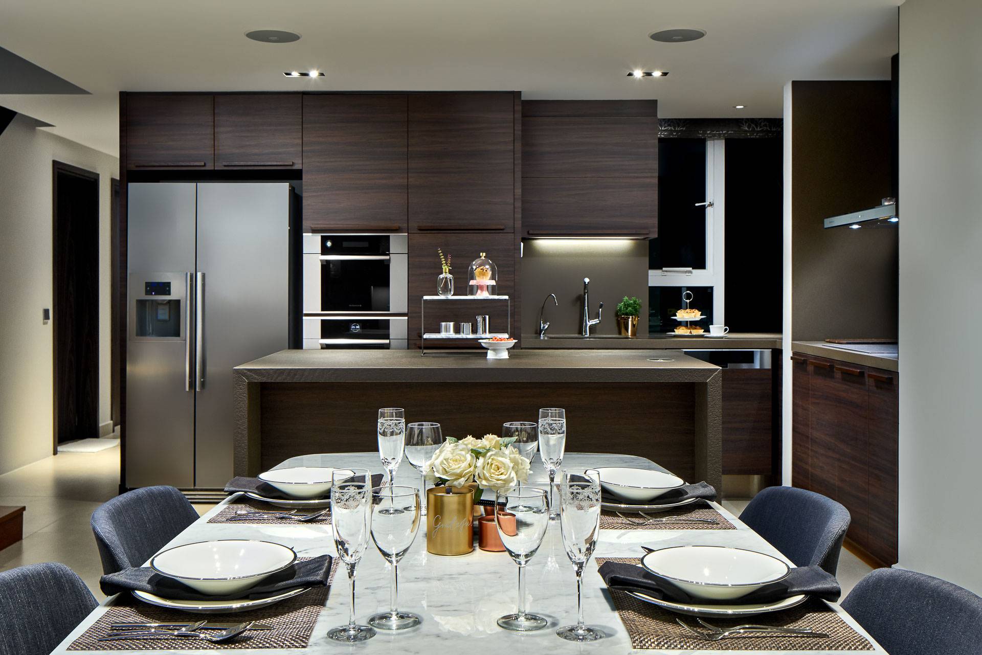 Interior design photography of kitchen table with glasses and plates at simei rise condominium in singapore